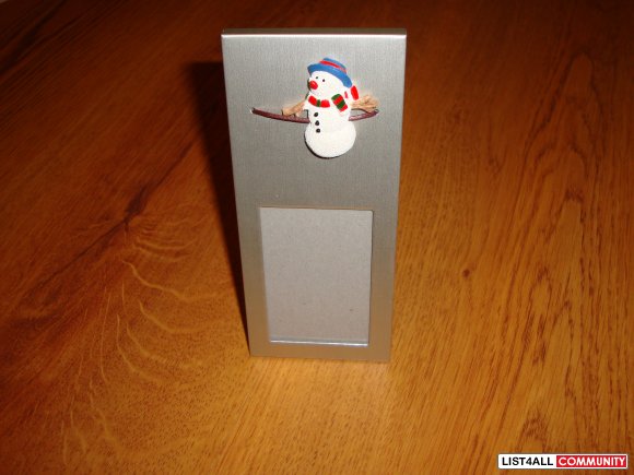Photo stand with snowman on it